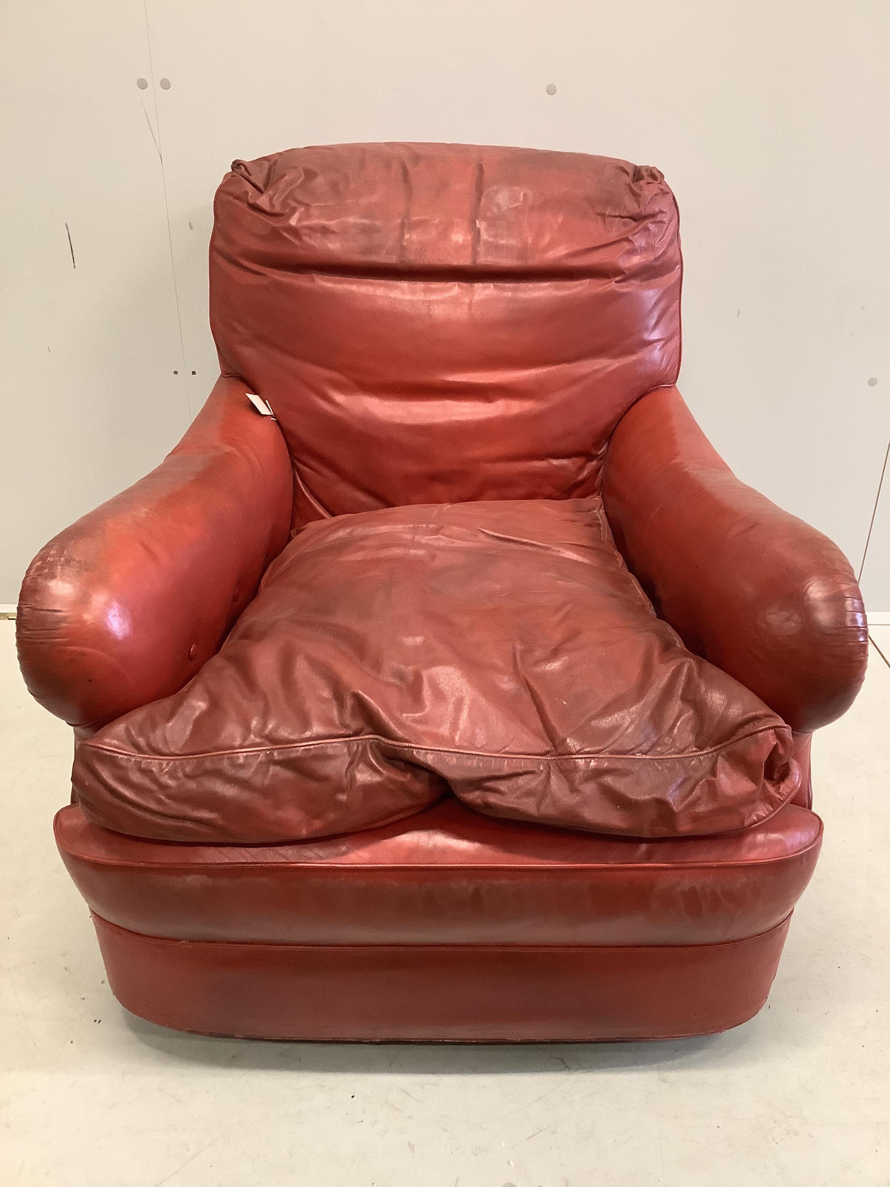 An Art Deco red leather club armchair, width 75cm, depth 90cm, height 80cm. Condition - poor to fair